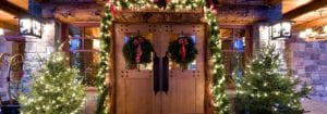 Front doors with Christmas decorations.
