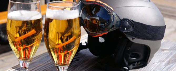 Beer glasses and a ski helmet and goggles.