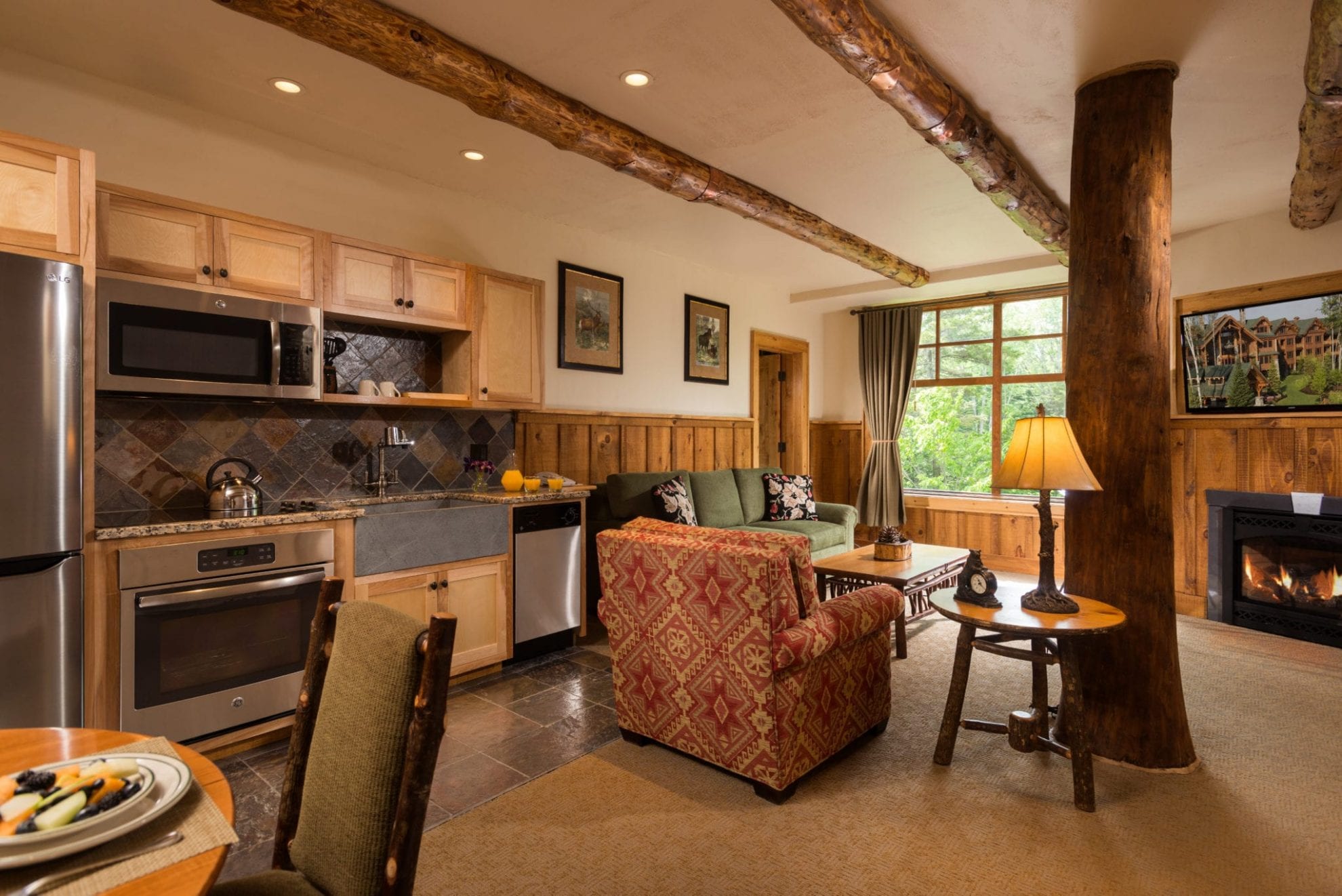 Suite with kitchen, living room and fireplace.