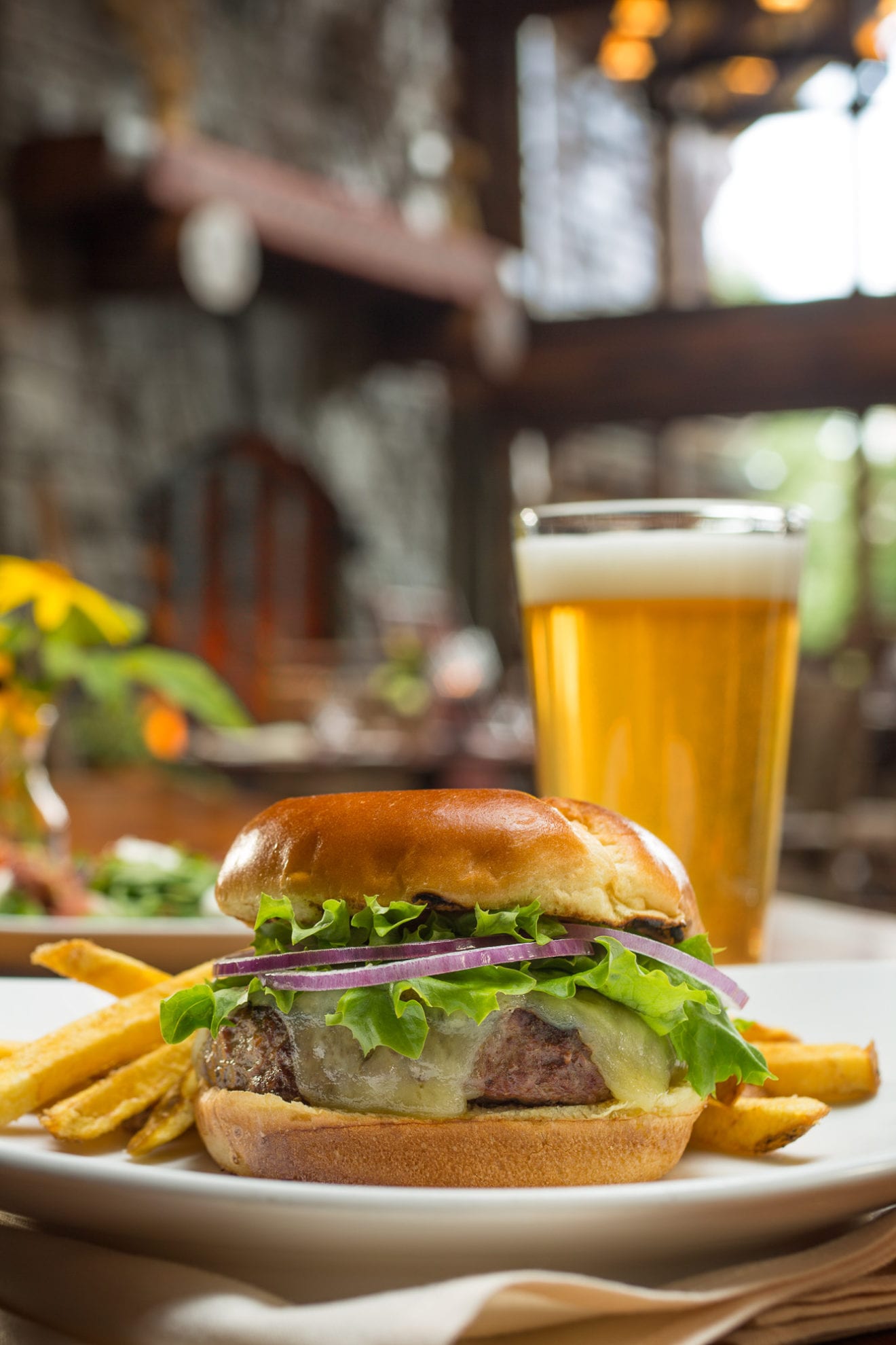 Hamburger, fries and a glass of beer.
