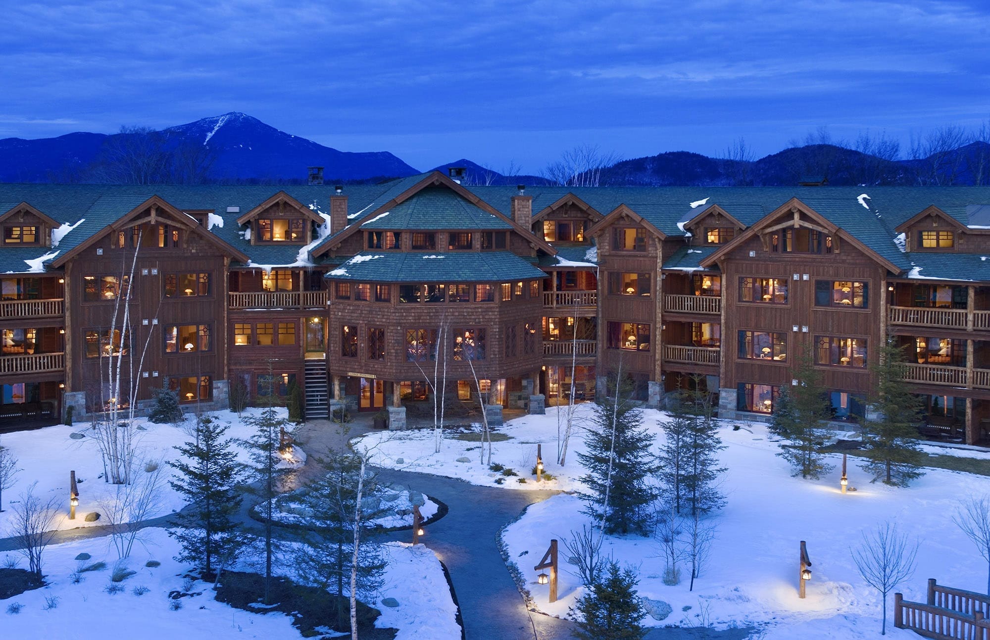 Whiteface Lodge exterior at dusk in winter.