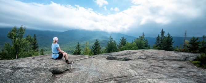 Woman on a mountain overlook.