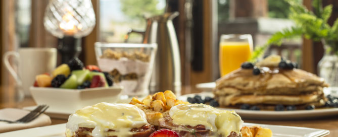 Cinnamon rolls, breakfast fruit, pancakes