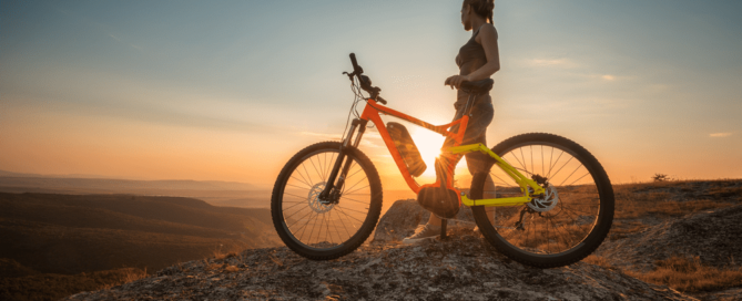 Picture of woman enjoying mountain bike trails.