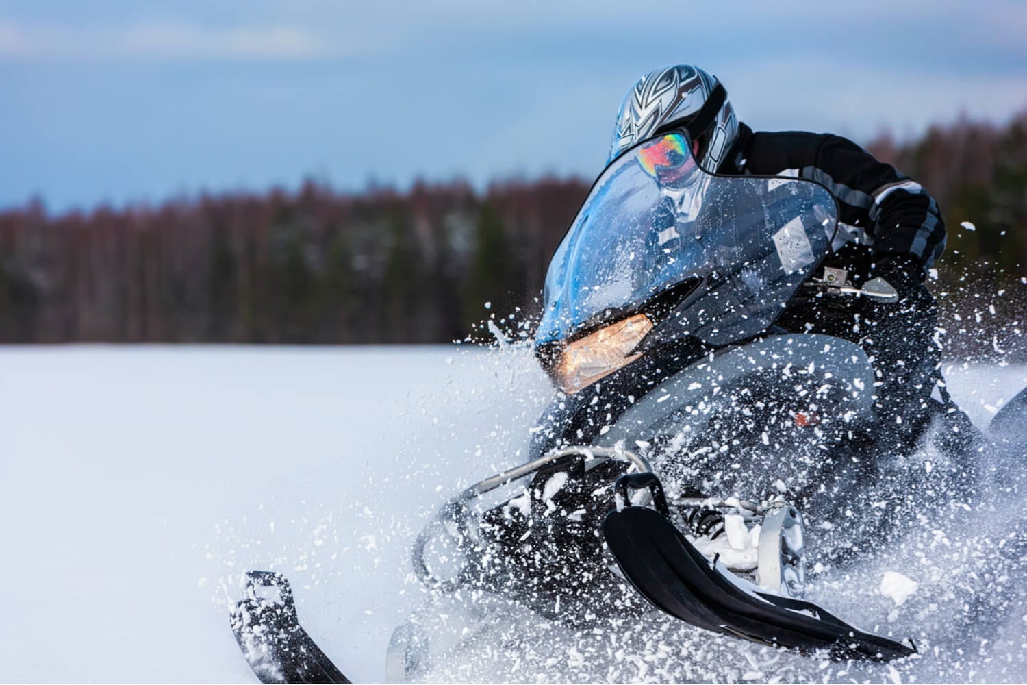 Picture of person enjoying a Lake Placid snowmobile adventure.