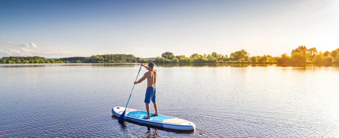 Paddleboarding is one of the essential Lake Placid summer activities