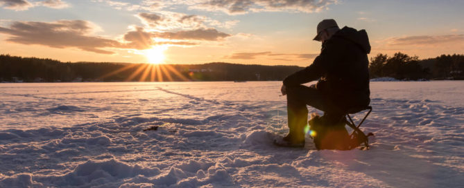 A man ice fishing near Lake Placid, New York
