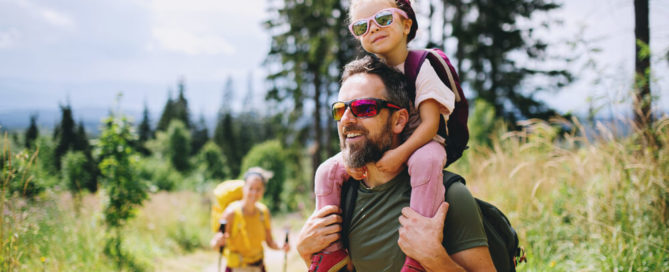 A family enjoying a hike in Lake Placid over Labor Day weekend