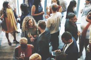 Co-workers mingling at a corporate retreat in Upstate New York