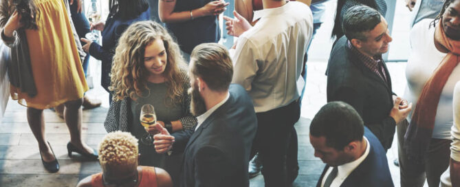 Co-workers mingling at a corporate retreat in Upstate New York