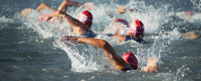 Athletes swimming at Ironman Lake Placid