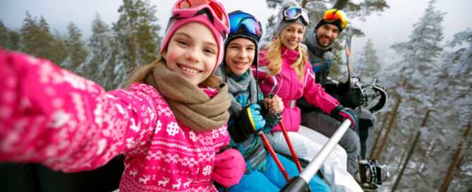 A family on a chairlift during the holiday season in Lake Placid