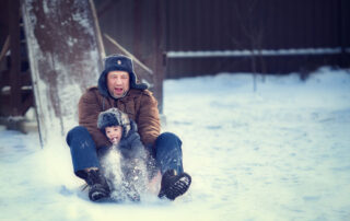 A father and son on the Lake Placid Toboggan Chute