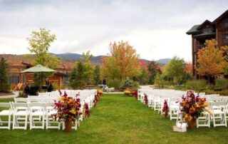 An empty wedding ceremony set against the fall colors in the Adirondacks