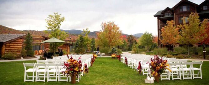 An empty wedding ceremony set against the fall colors in the Adirondacks