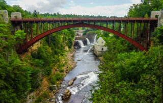 A view of High Falls Gorge framed under a bridge, one of the best things to see in the Adirondacks